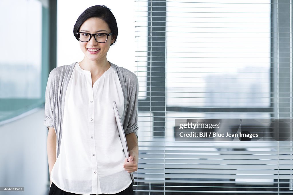 Cute businesswoman with glasses in the office