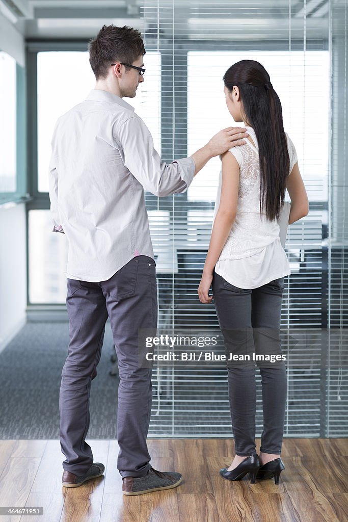 Businessman consoling his workmate