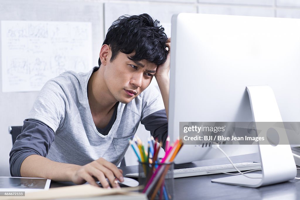 Worried young man in the office