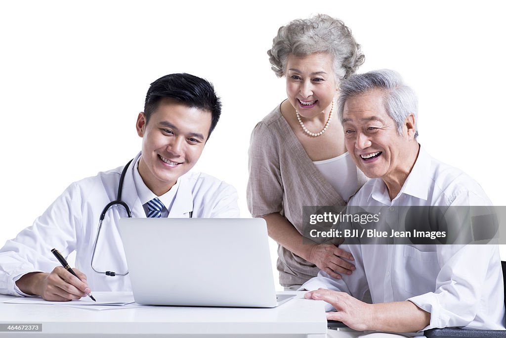 Doctor and patient seeing the results on laptop