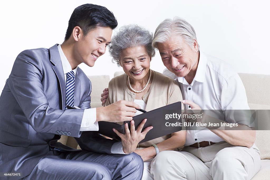 Senior couple with financial advisor