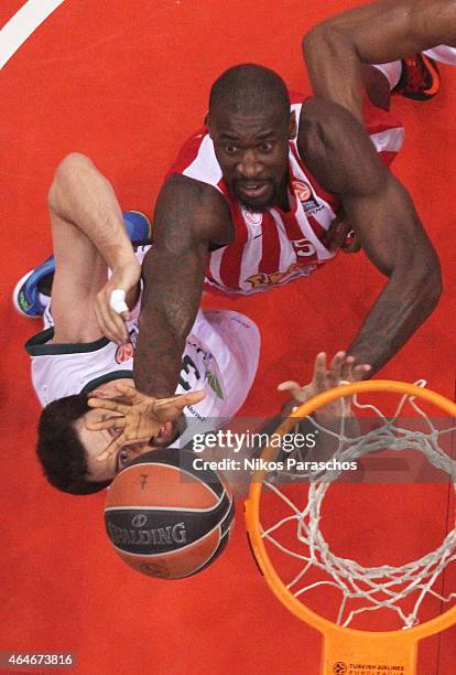 Othello Hunter, #5 of Olympiacos Piraeus competes with German Gabriel, #3 of Unicaja Malaga during the Turkish Airlines Euroleague Basketball Top 16...