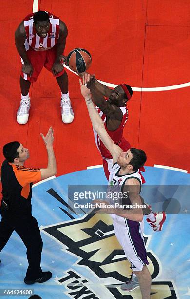 Fran Vazquez, #17 of Unicaja Malaga competes with Brent Petway, #4 of Olympiacos Piraeus during the Turkish Airlines Euroleague Basketball Top 16...