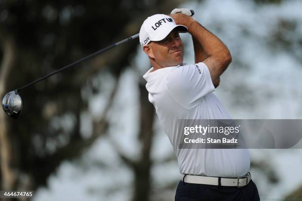 Stewart Cink hits a tee shot on the 18th hole during the first round of the Farmers Insurance Open on Torrey Pines South on January 23, 2014 in La...