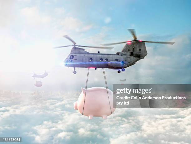 helicopters carrying piggy banks over clouds - helikopter bildbanksfoton och bilder