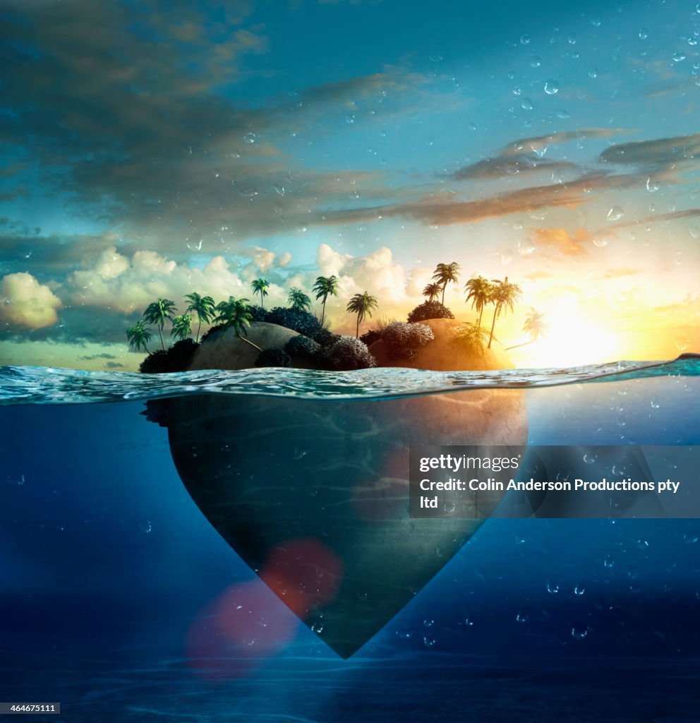 Heart-shape island floating in tropical ocean