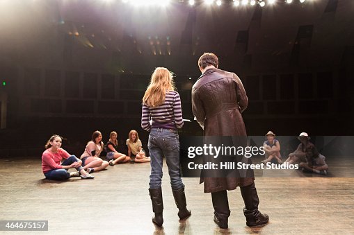 Students practicing lines on stage Students practicing lines on stage