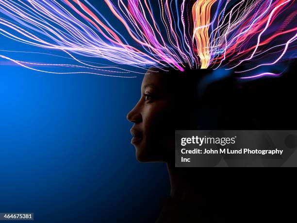 light trails coming from african american's head - emotion foto e immagini stock