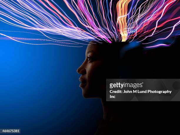 light trails coming from african american's head - human brain stock pictures, royalty-free photos & images