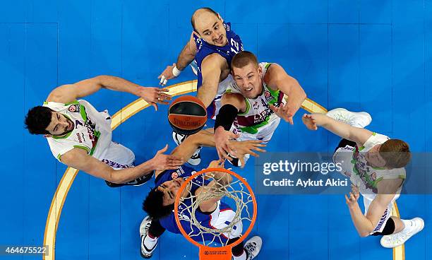 Nenad Krstic, #12 of Anadolu Efes Istanbul and Dario Saric, #9 of Anadolu Efes Istanbul compete with Davis Bertans, #42 of Laboral Kutxa Vitoria,...