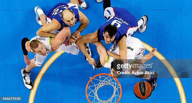 Nenad Krstic, #12 of Anadolu Efes Istanbul and Dario Saric, #9 of Anadolu Efes Istanbul compete with Colton Iverson, #4 of Laboral Kutxa Vitoria and...