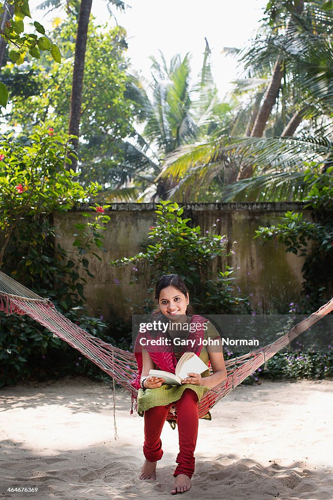 Young Indian woman relaxin on hammock