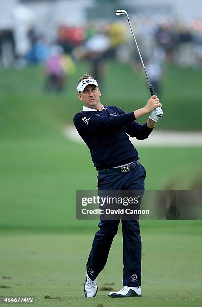 Ian Poulter of England plays his second shot on the par 4, first hole during the second round of The Honda Classic on the Champions Course at the PGA...