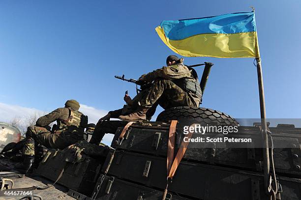 Soldiers in the Ukrainian Army withdraw 15, 100 mm caliber artillery guns in Soledar, eastern Ukraine, on February 27, 2015. In accordance with a...