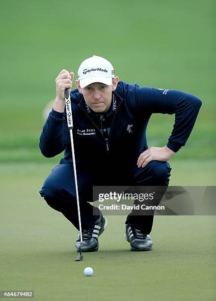 Stephen Gallacher of Scotland lines up a putt on the par 5, third hole during the second round of The Honda Classic on the Champions Course at the...