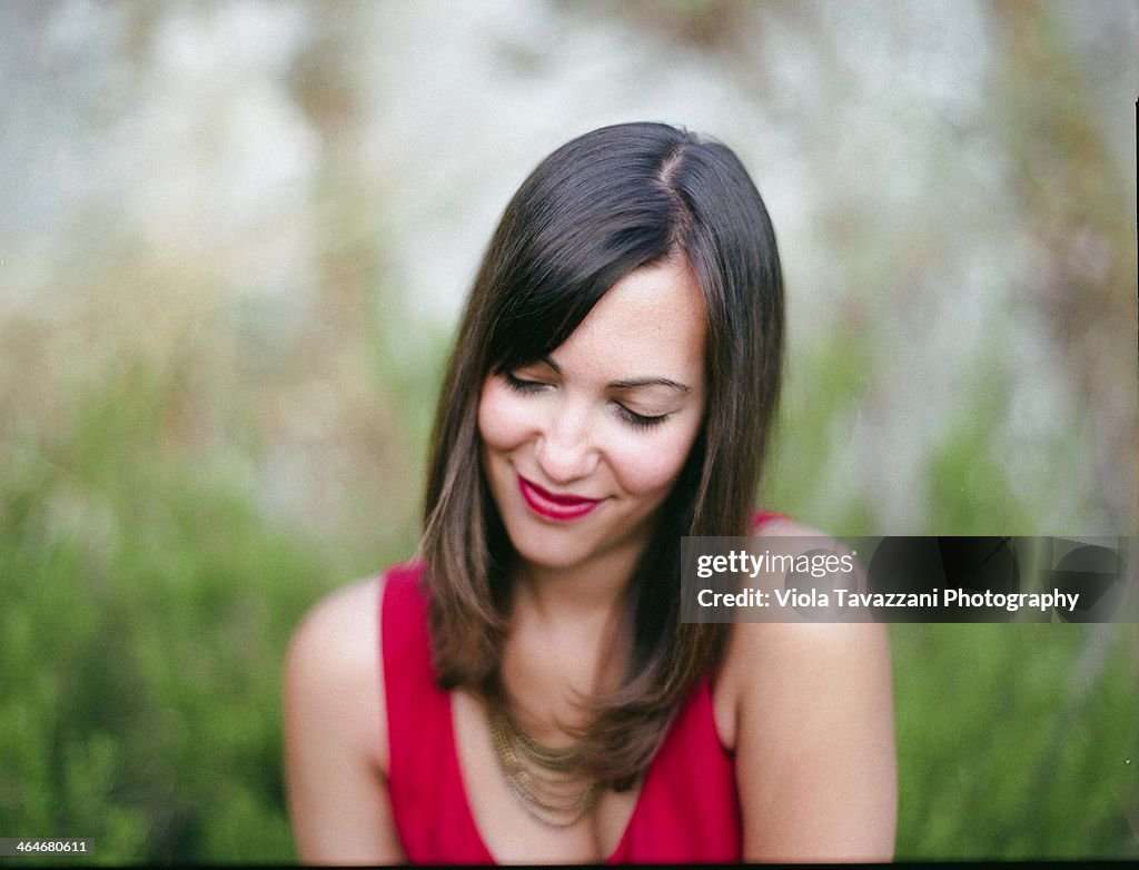 Girl in red smiling