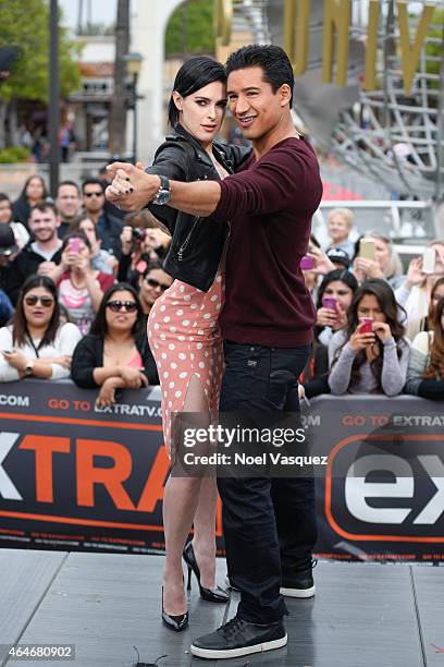 Rumer Willis and Mario Lopez pose together at "Extra" at Universal Studios Hollywood on February 27, 2015 in Universal City, California.