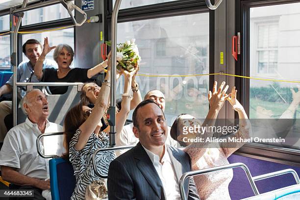 bride throwing bouquet on city bus just married. - catching bouquet stock pictures, royalty-free photos & images