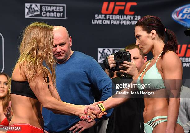 Opponents Ronda Rousey and Cat Zingano shake hands during the UFC 184 weigh-in at the Event Deck and LA Live on February 27, 2015 in Los Angeles,...