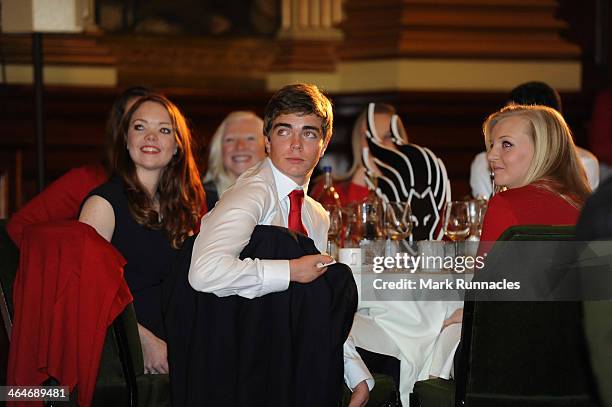 Alpine skiers Jade Etherington, James Whitley and guide Rachel Ferrier of the ParalympicsGB team listens to a speaker during a gala dinner to...