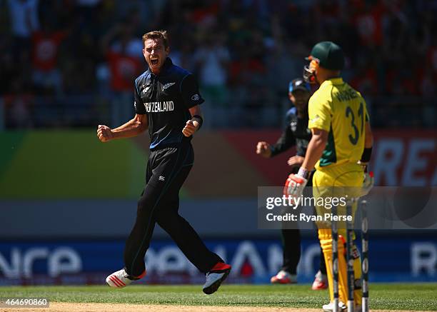 Tim Southee of New Zealand celebrates after taking the wicket of David Warner of Australia during the 2015 ICC Cricket World Cup match between...