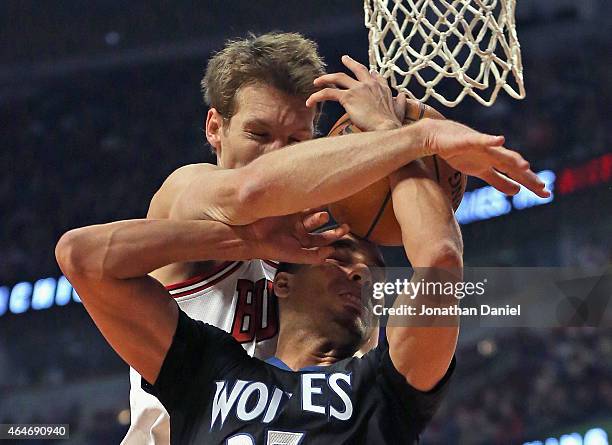 Mike Dunleavy of the Chicago Bulls fouls Kevin Martin of the Minnesota Timberwolves at the United Center on February 27, 2015 in Chicago, Illinois....