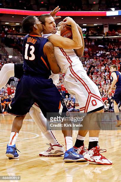 Aaron Craft of the Ohio State Buckeyes and Tracy Abrams of the Illinios Fighting Illini battle for control of the ball during the first half at Value...