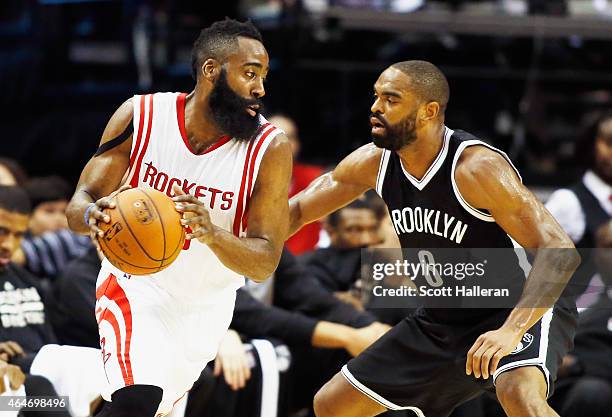 James Harden of the Houston Rockets looks to drive against Alan Anderson of the Brooklyn Nets during their game at the Toyota Center on February 27,...