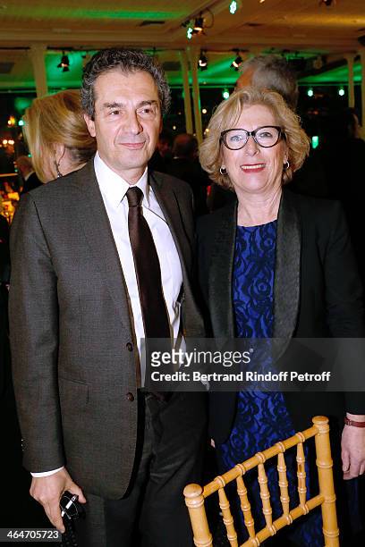 Professor Yves Levy and French Minister of Higher Education and Research Genevieve Fioraso attend the Sidaction Gala Dinner 2014 at Pavillon...