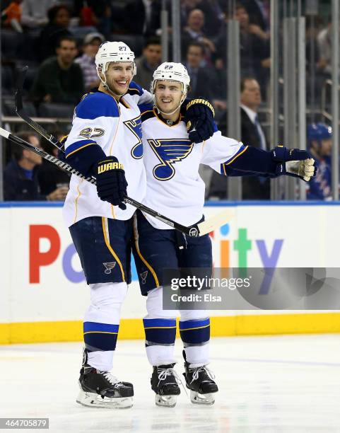 Kevin Shattenkirk of the St. Louis Blues is congratulated by teammate Alex Pietrangelo after Shatenkirk scored the game winning goal in the third...