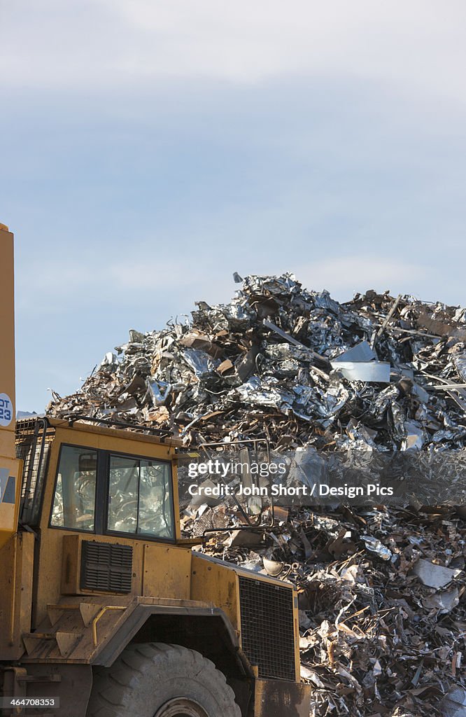 A Truck In Front Of A Large Pile Of Garbage
