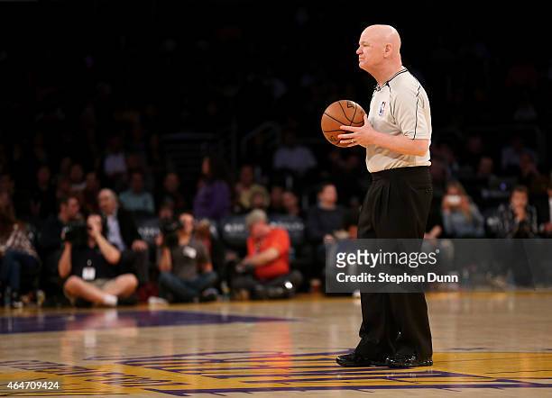 Referee Joe Crawford waits to throw up the opening tipoff for game between the Milwaukee Bucks and the Los Angeles Lakers at Staples Center on...