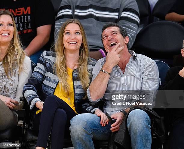 Antonio Banderas and Nicole Kimpel attend a basketball game between the Milwaukee Bucks and the Los Angeles Lakers at Staples Center on February 27,...