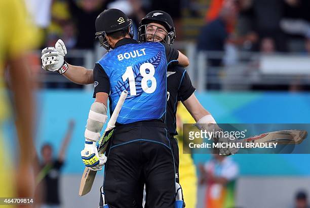 New Zealand's Kane Williamson and Trent Boult celebrate beating Australia during their 2015 Cricket World Cup Pool A match at Eden Park in Auckland...