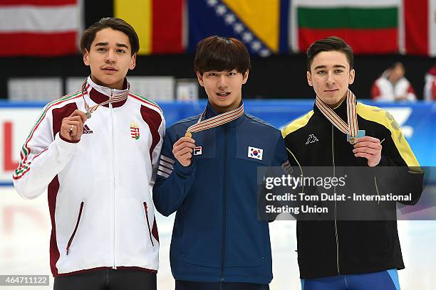 Shaolin Sandor Liu of Hungary, Dagyeom Kim of Korea and Denis Nikisha of Kazakhstan pose during the medal ceremony for the Men's 500m final race on...