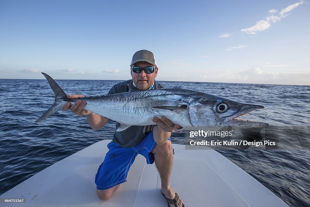 Man Getting Fish Man Holding A Large Fresh Caught Fish High-Res Stock Photo - Getty Images