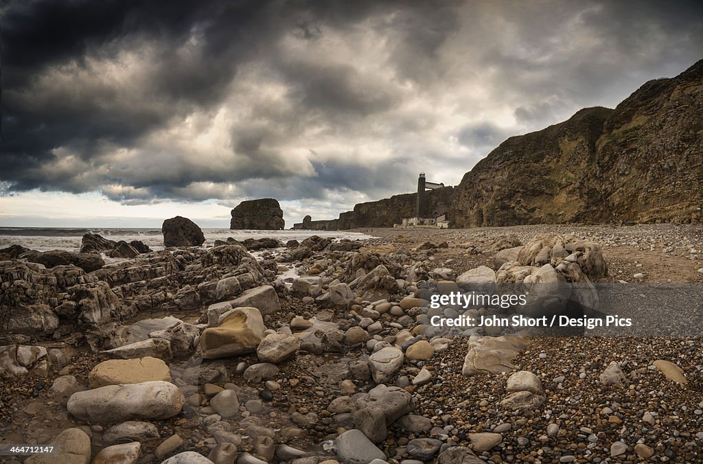 A Rocky Beach Along The Water's Edge