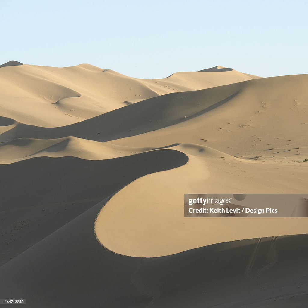 Desert Landscape Of Sand Slopes And Ridges