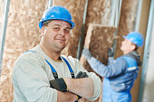 Construction worker at insulation work