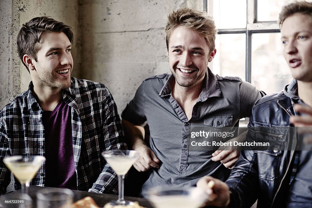 Male friends hanging out and having some drinks.