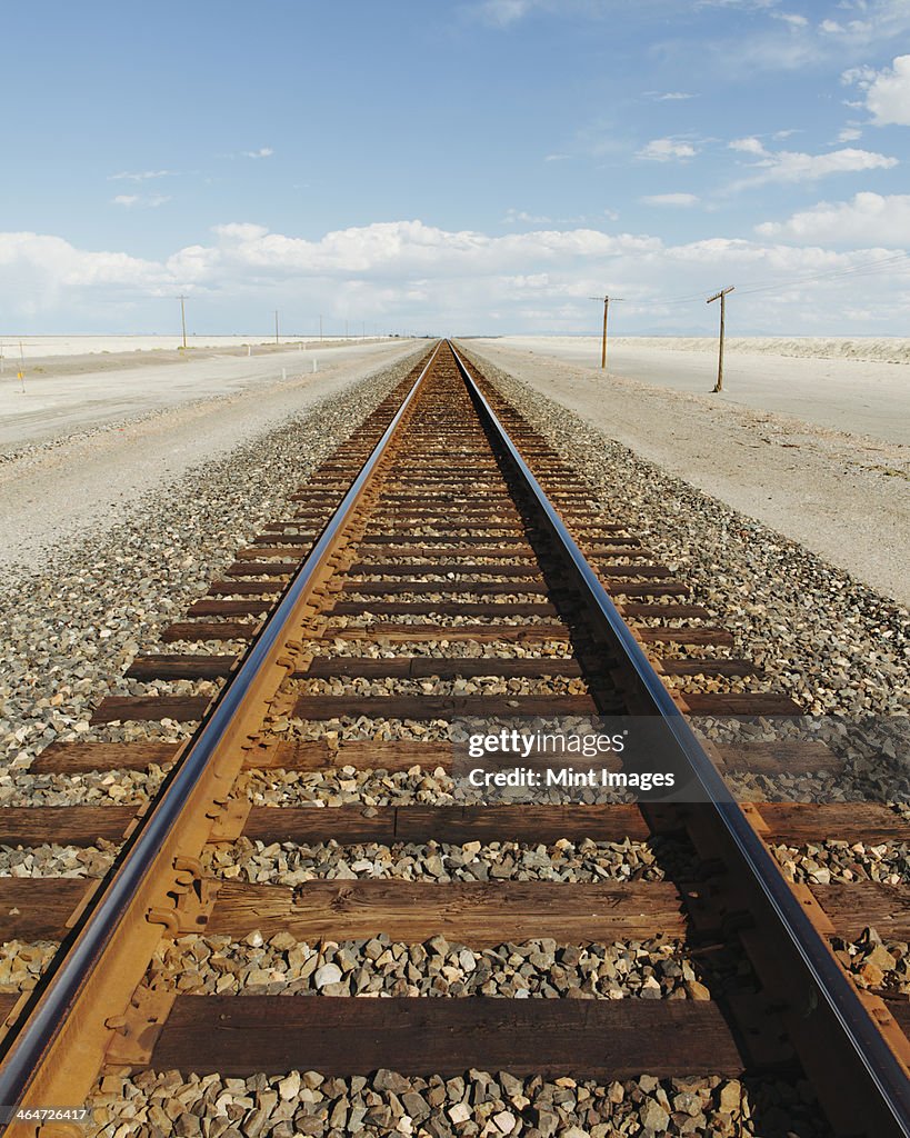 A railroad extending through the desert,near Wendover in Utah.