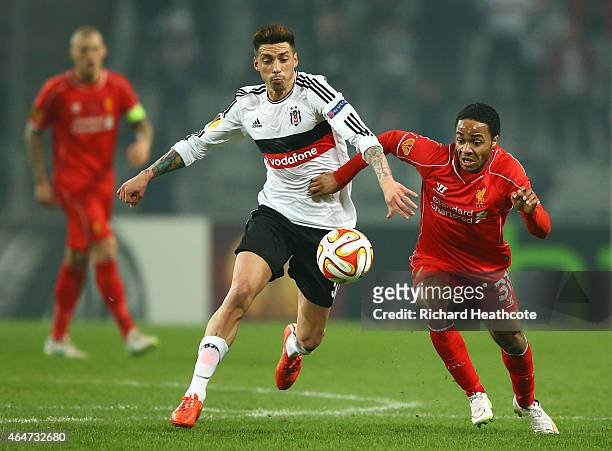 Jose Ernesto Sosa of Besiktas battles with Raheem Sterling of Liverpool during the 2nd leg of the UEFA Europa League Round of 32 match between...