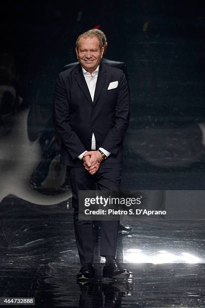 Designer Ermanno Scervino acknowledges the applause of the audience after the Ermanno Scervino show during the Milan Fashion Week Autumn/Winter 2015...