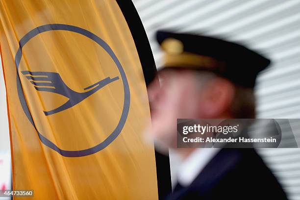 Lufthansa pilote wait during a presentation of the new plane by Airbus officials on February 27, 2015 in Munich, Germany. The A350 is a long-distance...