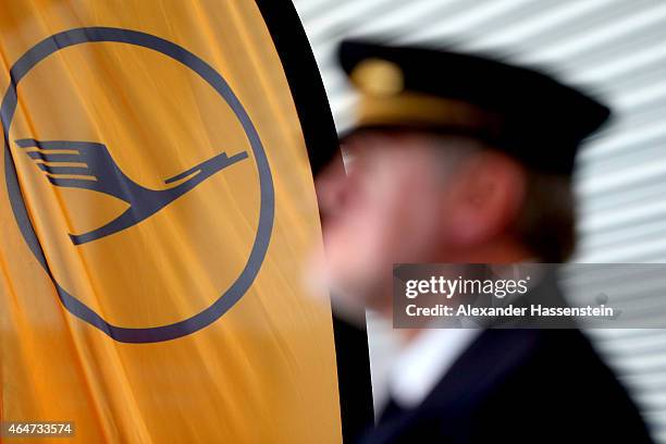 Lufthansa pilote wait during a presentation of the new plane by Airbus officials on February 27, 2015 in Munich, Germany. The A350 is a long-distance...
