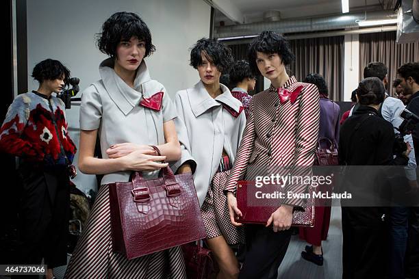 Models are seen backstage ahead of the Emporio Armani show during the Milan Fashion Week Autumn/Winter 2015 on February 27, 2015 in Milan, Italy.