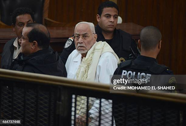 Egypt's former Muslim Brotherhood supreme guide Mohammed Mahdi Akef looks on during his trial at the non-commissioned police officers institute in...