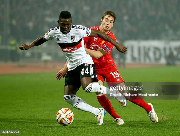 Daniel Opare of Besiktas holds off Javi Manquillo of Liverpool during the 2nd leg of the UEFA Europa League Round of 32 match between Besiktas and...