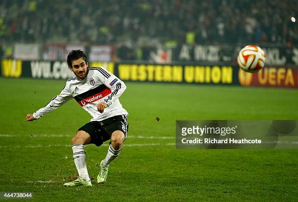 Veli Kavlak of Besiktas scores his penalty in the shoot out during the 2nd leg of the UEFA Europa League Round of 32 match between Besiktas and...