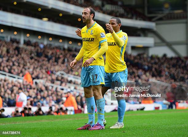 Glenn Murray of Crystal Palace celebrates with team mate Jason Puncheon as he scores their first goal during the Barclays Premier League match...